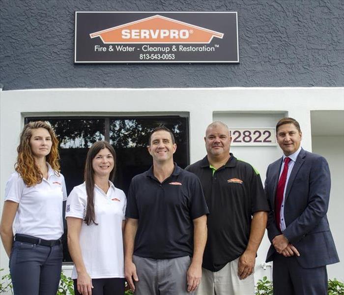 4 SERVPRO team members and local banking manager